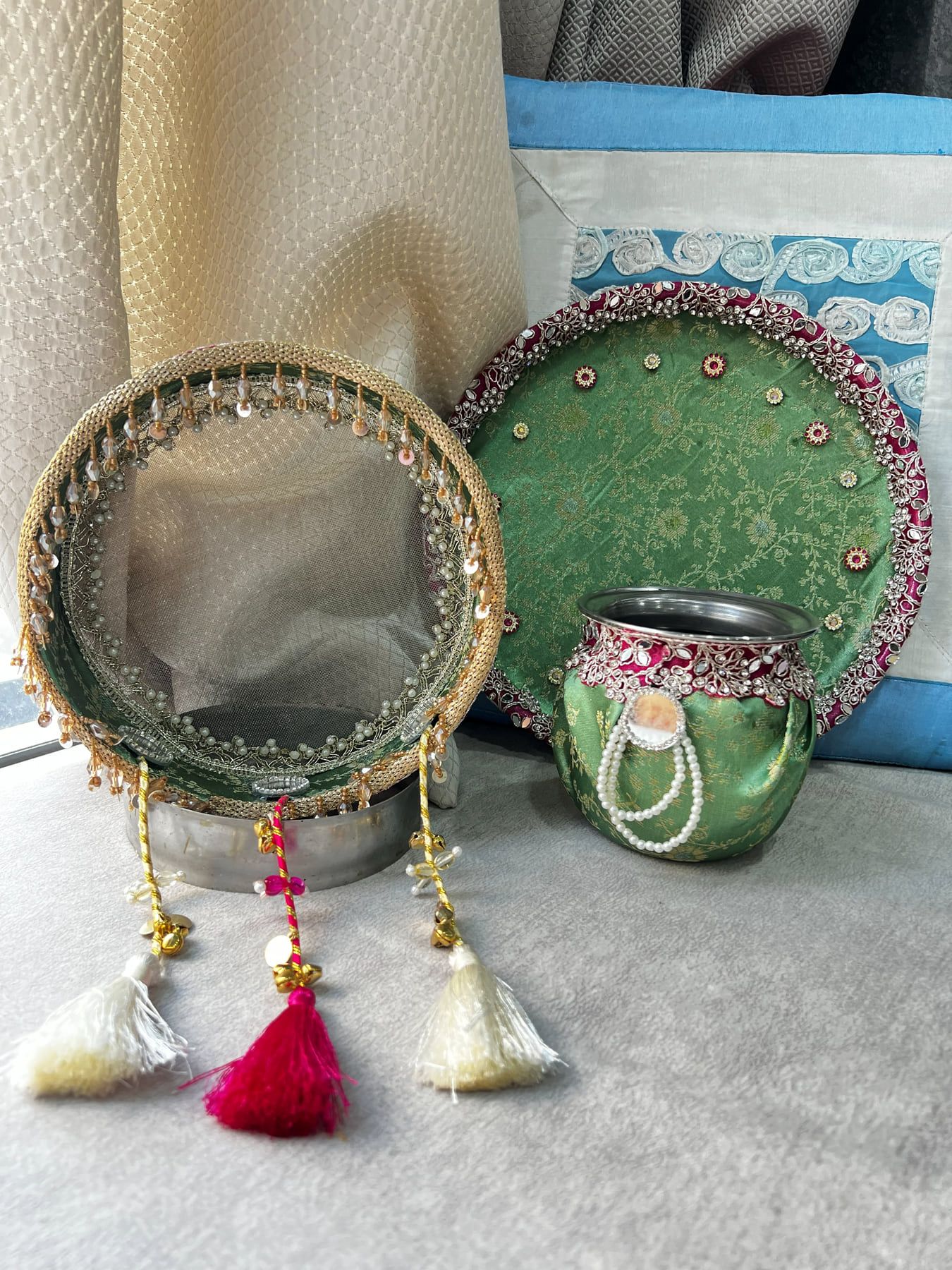 Green and pink Karwa Chauth set with tasselled chalni, brocade thali and pearl-decorated karwa